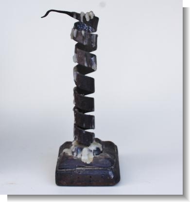 RARE SQUARE BASE IRON TWIST CANDLESTICK.